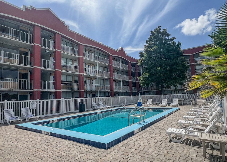 Pool surrounded by chairs